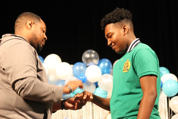 Students receive rings at the Ring Ceremony.